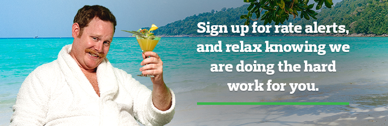 Man relaxing on beach chair with cocktail