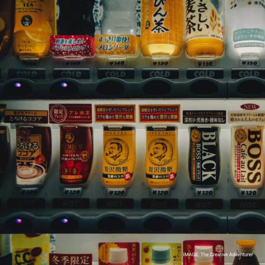 Japanese Vending Machine dispensing Boss Coffee.