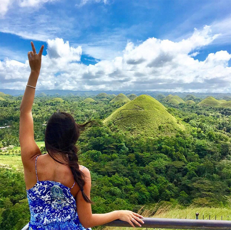 Girl in front of Chocolate Hills Philippines