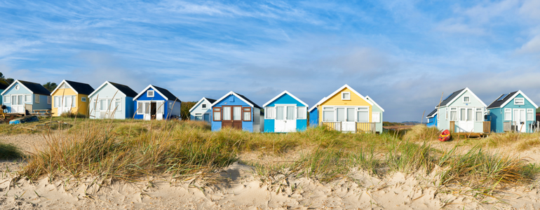 Colourful houses at Mudeford, England. Royalty-free image.
