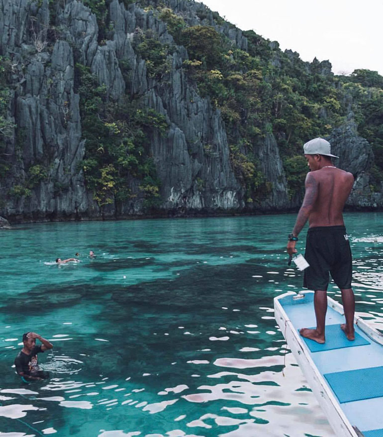 Man on boat in Philippines