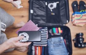 Man packing suitcase for holiday